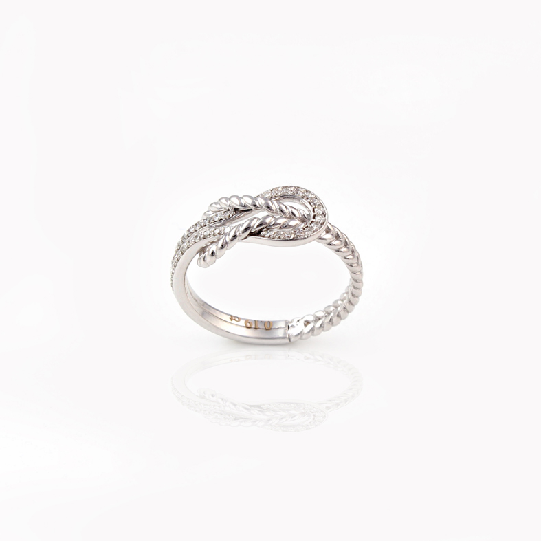 Anello infinito in oro bianco R186 con diamanti da 0,19 ct